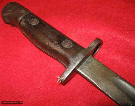 Enfield 1907 bayonet markings - Siamese 1907 Mauser Bayonet No markings. Wood grips held by two rivets. Double edged blade with a parkerized style finish with no sharpening. Blued metal scabbard with oval frog stud with no markings. Rarity: R2 ... British 1887 MkIII Bayonet Made by Enfield and dated '/88'. Worn checkered leather grips held by 4 rivets with a press stud …